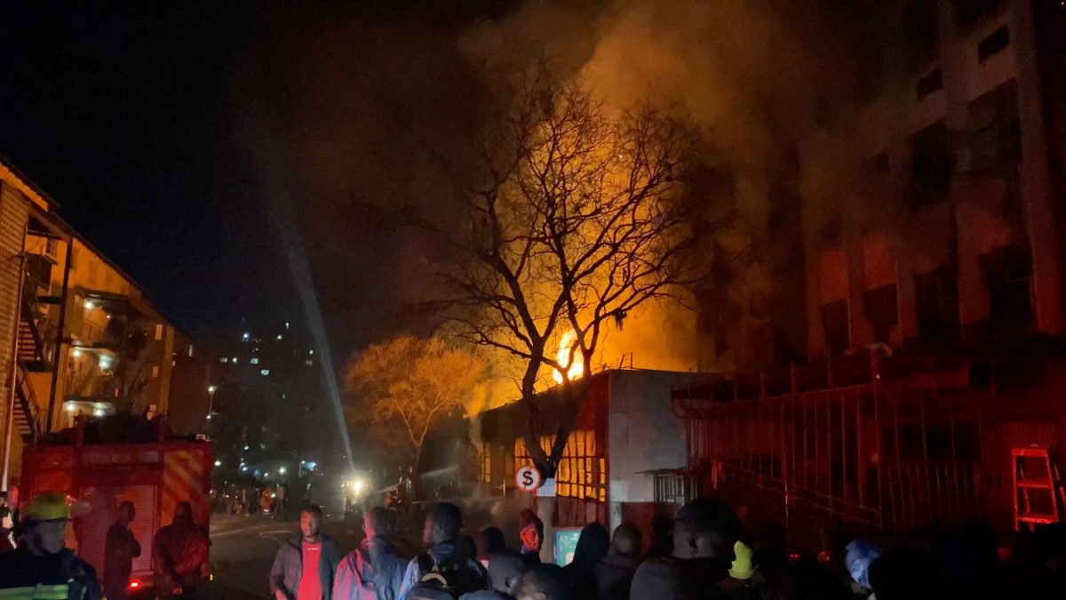 Flames rise from a building amid a deadly fire, in Johannesburg, South Africa, August 31, 2023, in this still image obtained from a social media video. X/@odirileram/via REUTERS