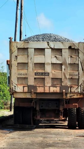 A truck with a load of uncovered and potentially dangerous gravel
