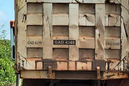 A truck with a load of uncovered and potentially dangerous gravel
