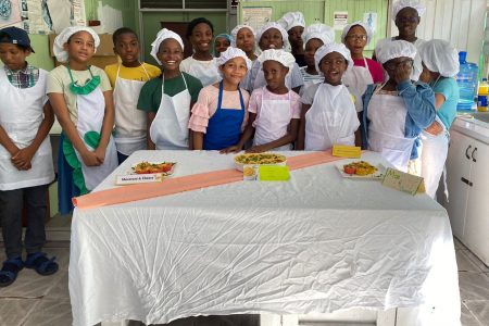 Children in vacation classes at the Carnegie School of Home Economics are clearly having a good time. (Carnegie School of Home Economics photo)