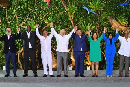 From left: Ecuador's Foreign Minister Gustavo Manrique, Guyana's Prime Minister Mark Phillips, Colombia's President Gustavo Petro, Brazil's President Luiz Inacio Lula da Silva, Bolivia's President Luis Arce, Peru's President Dina Boluarte, Venezuela's Vice President Delcy Rodriguez and Suriname's Foreign Minister Albert Ramdin pose for a family photo at the summit of the Amazon Cooperation Treaty Organization (ACTO), in Belem, Brazil August 8, 2023. © Cristian Garavito/Colombia Presidency via Reuters
