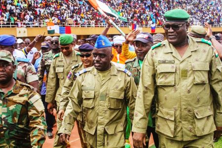 Members of a military council that staged a coup in Niger attend a rally at a stadium in Niamey, Niger, August 6, 2023. REUTERS/Mahamadou Hamidou/File Photo