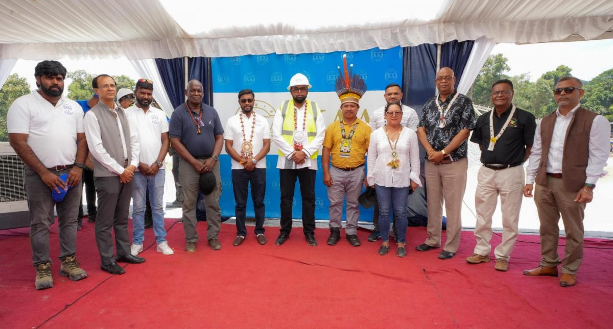 President Irfaan Ali (in hard hat) is flanked by Batavia, Toshao, Oren Willams (right) and CEO of EKAA HRIM Earth Resources, Saju Bhaskar. Also present are Minister of Natural Resources, Vickram Bharrat; Minister of Public Works, Juan Edghill; Minister of Home Affairs, Robeson Benn; Minister of Amerindian Affairs, Pauline Sukhai; and Speaker of the National Assembly, Manzoor Nadir