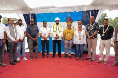 President Irfaan Ali (in hard hat) is flanked by Batavia, Toshao, Oren Willams (right) and CEO of EKAA HRIM Earth Resources, Saju Bhaskar. Also present are Minister of Natural Resources, Vickram Bharrat; Minister of Public Works, Juan Edghill; Minister of Home Affairs, Robeson Benn; Minister of Amerindian Affairs, Pauline Sukhai; and Speaker of the National Assembly, Manzoor Nadir