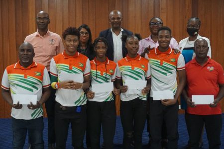 In excess of $1M was rewarded to the Commonwealth Youth Games history making quartet yesterday by the brass of the Guyana Olympic Association (Emmerson Campbell photo)
