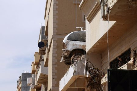 A destroyed car sits on top of a residential building following fatal floods in Derna, Libya, September 17, 2023. (Reuters photo)