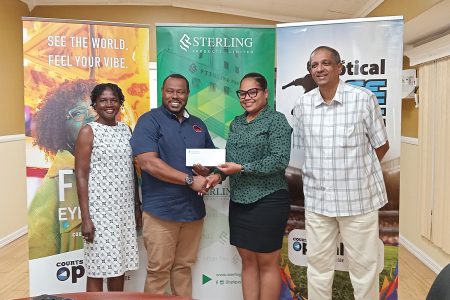 Petra Organization Co-Director Troy Mendonca (2nd from left) receiving the sponsorship cheque from Yolanda McCammon, PRO of SPL, in the presence of Petra Organization member Lavern Fraser-Thomas and CEO of SPL Ramsay Ali