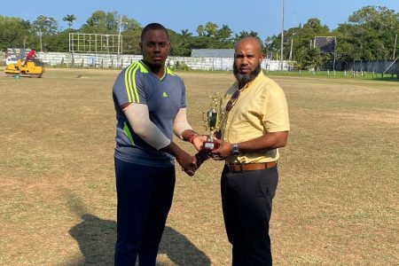 Man of the match, Nkosi Beaton (left), collects his award from GCB’s Anthony D’Andrade