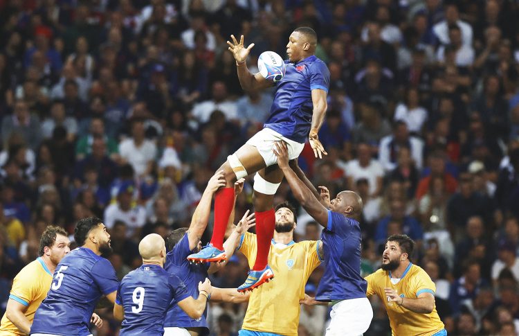 Cameron Woki of France
(mid-air) about to receive a pass during a line out segment against Uruguay in Pool A of the Rugby World Cup
