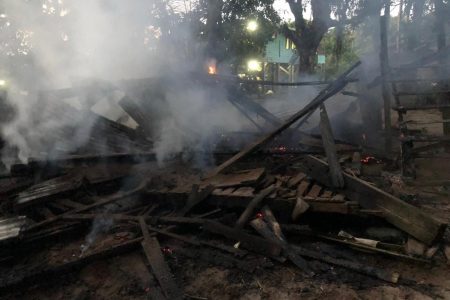 The smouldering ruins of the house that was destroyed by fire at Itaballi Landing