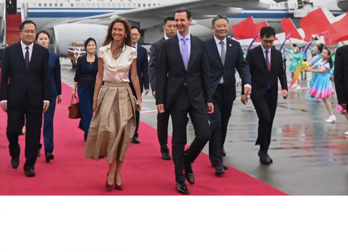 Syrian President Bashar Assad, center right, arrives in Hangzhou on Sept. 21, ahead of a meeting with Chinese President Xi Jinping. (Xinhua via AP)
