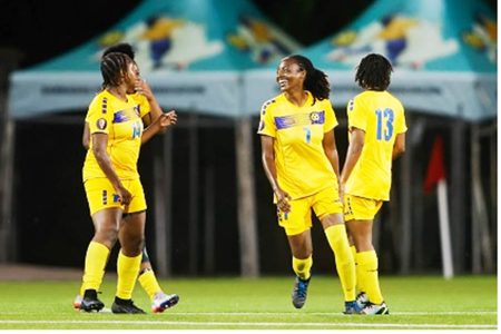 Barbados players (from left) Keinelle Johnson, Shanice Stevenson, and Shauntae Hinds celebrate after their side score a goal (Photo by Miguel Gutiérrez/Straffon Images/Concacaf)
