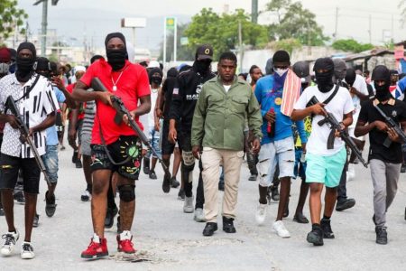 Former police officer Jimmy "Barbecue" Cherizier (centre), leader of the 'G9' coalition, leads a march surrounded by his security against Haiti's Prime Minister Ariel Henry, in Port-au-Prince, Haiti September 19, 2023. REUTERS/Ralph Tedy Erol