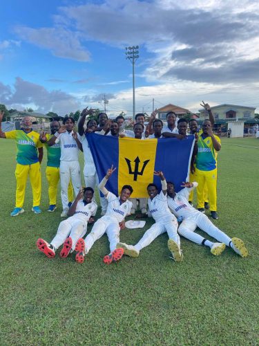 Head coach Dexter Toppin (left) and members of the Barbados squad celebrate after they won the CWI Under-17 Rising Stars two-day tournament to crowned double champions.