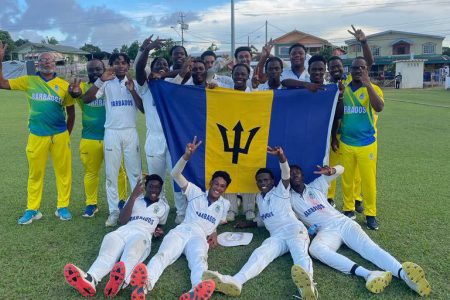 Head coach Dexter Toppin (left) and members of the Barbados squad celebrate after they won the CWI Under-17 Rising Stars two-day tournament to crowned double champions.