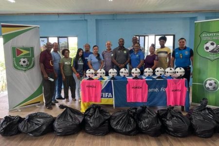 GFF President Wayne Forde (6th from right) poses with members of the BFA and club representatives following the conclusion of the equipment presentation.