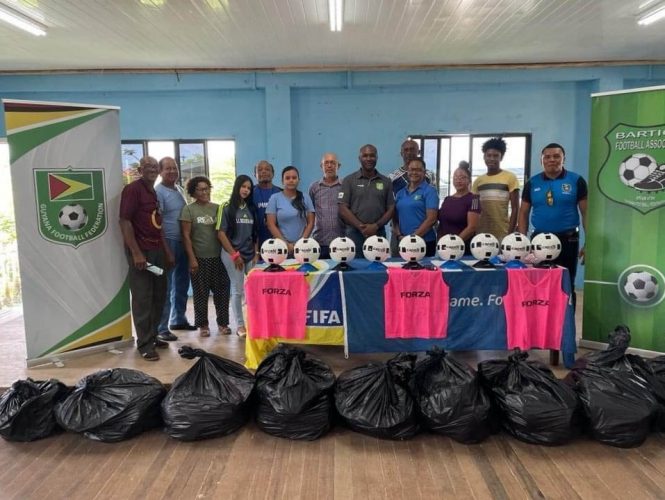 GFF President Wayne Forde (6th from right) poses with members of the BFA and club representatives following the conclusion of the equipment presentation.