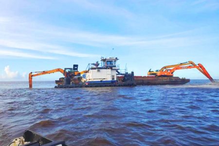 Dredging of the Pomeroon River mouth by Gaico at the start of the project