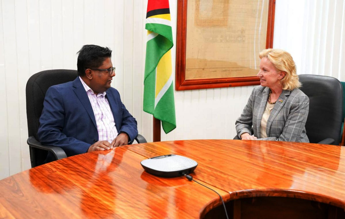US Ambassador Sarah-Ann Lynch (right) in a farewell call with Minister of Finance Dr Ashni Singh on Tuesday.  (Ministry of Finance photo)