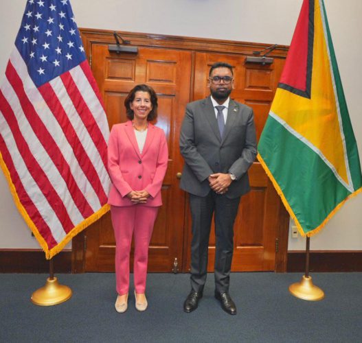 Gina Raimondo (left) with President Irfaan Ali (Office of the President photo)