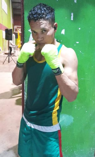 Christopher Henry of the Guyana Defence
Force strikes a pose after his devastating second round knockout of Shawn Rodney in a light
middleweight bout as the Guyana Boxing Association’s Andrew `Sixhead’ Lewis’
National Novices championships boxed
off at the National Gymnasium last night.