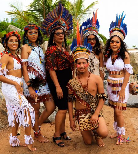 Costumed Amerindians with Natasha standing at centre