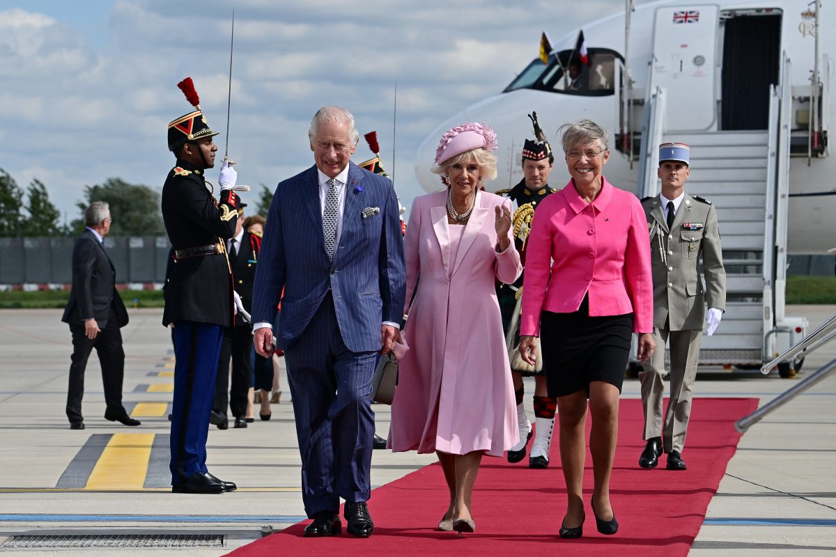 French Prime Minister Elisabeth Borne (right) welcomes Britain’s King Charles and Britain’s Queen Camilla upon their arrival at the Orly Airport on September 20, 2023, on the first day of a state visit to France. Britain’s King Charles III and his wife Queen Camilla are on a three-day state visit to France.     MIGUEL MEDINA/Pool via REUTERS