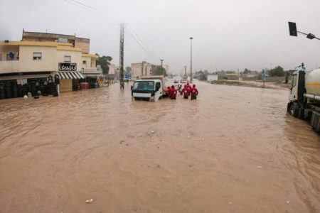 This picture released by the Libyan Red Crescent September 11, 2023, shows members of their team working on opening roads engulfed in floods at an undefined location in eastern Libya. At least 150 people were killed when freak floods hit eastern Libya, officials said today, after storm Daniel swept the Mediterranean, lashing Turkiye, Bulgaria and Greece. — Libyan Red Crescent/HO/AFP pic