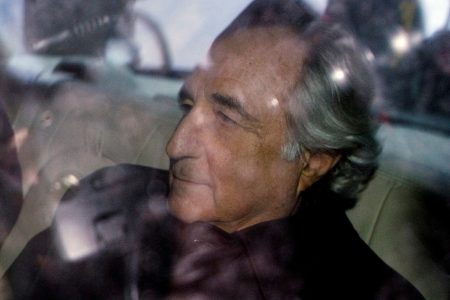 FILE PHOTO: Bernard Madoff is escorted in a vehicle from Federal Court in New York January 5, 2009. REUTERS/Lucas Jackson/File Photo