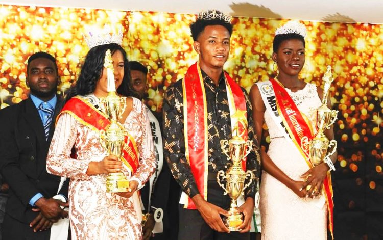 Reshma Seemangal (left) and Anthonio Johnson (centre) after winning the Miss and Mr Deaf Guyana pageant in 2022