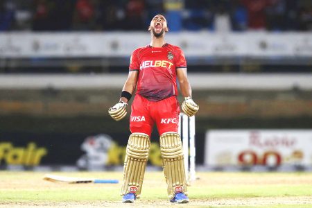  Nicholas Pooran of Trinbago Knight Riders celebrates reaching his century during the Republic Bank Caribbean Premier League match against the Barbados Royals at the Queen’s Park Oval last night.
(Photo by Ashley Allen - CPL T20/CPL T20 via Getty Images)