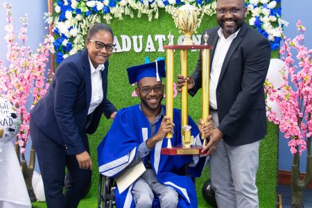 Permanent Secretary of the Ministry of Health, Malcolm Watkins (right) presenting a trophy.to Gabriel Gilkes. (Ministry of Health photo)
