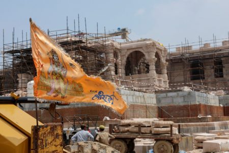 A religious flag is seen in front of the under-construction Hindu Ram Temple in Ayodhya in India, July 9, 2023.(photo credit: REUTERS/ADNAN ABIDI)