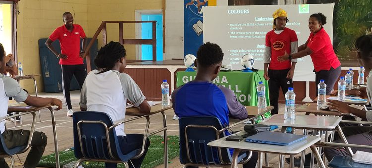 FIFA Instructor Natasha Lewis uses participant Ebo McNeil during a demonstration.
