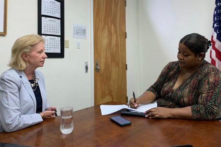 Marcelle Thomas (right) interviewing the US Ambassador Sarah-Ann Lynch