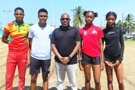 Director of Sport, Steve Ninvalle (centre) poses with (from left) Malachi Austin,
Javon Roberts, Narissa McPherson and Tianna Springer. (Emmerson Campbell photo)