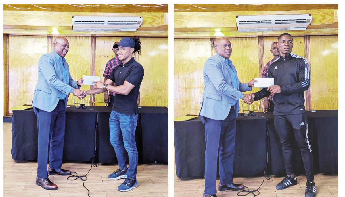 Guyana Boxing Association president Steve Ninvalle presents monetary incentives to Keevin Allicock, left and Desmond Amsterdam yesterday for their success at this year’s AMBC championships. The two boxers will leave Guyana Saturday for training in Cuba