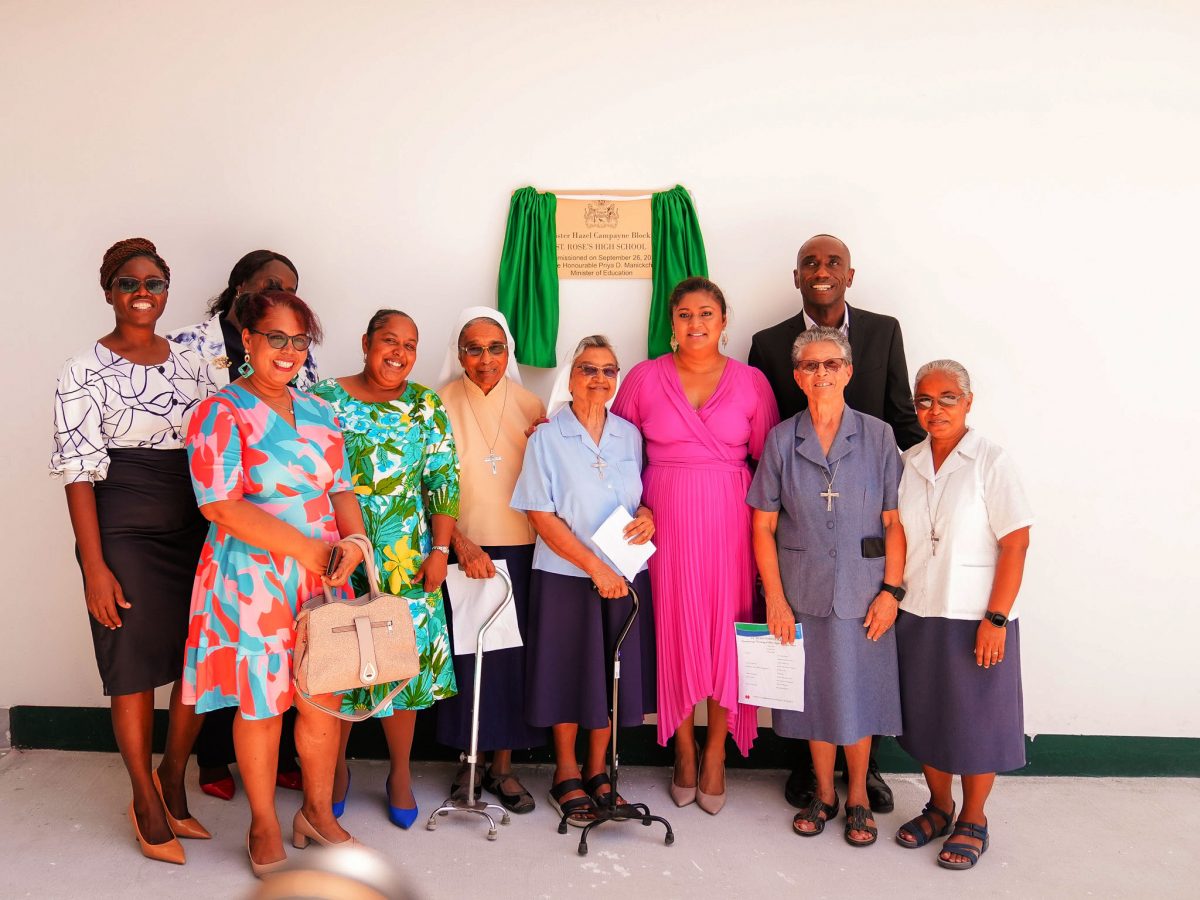 Minister of Education Priya Manickchand (fourth from right) with the Ursuline sisters and others at the commissioning. (Ministry of Education photo)
