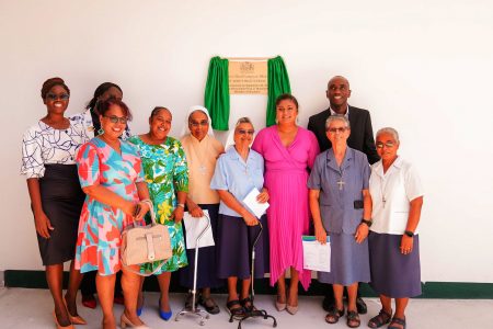 Minister of Education Priya Manickchand (fourth from right) with the Ursuline sisters and others at the commissioning. (Ministry of Education photo)
