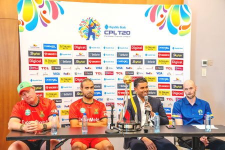 From left, Guyana Amazon Warriors head coach Lance Klusener, Captain Imran Tahir, Minister of Sports, Charles Ramson Jr and head of CPL marketing, Chris Watson.