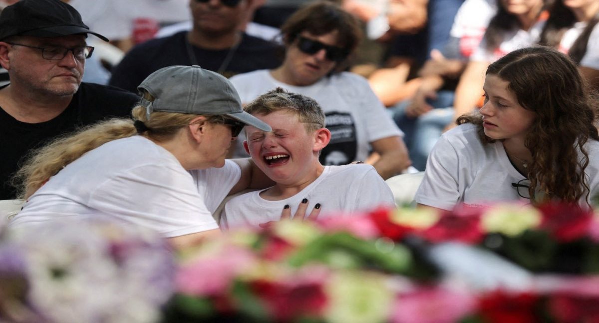 Shahar, 9, the brother of Maayan Idan, 18, who was killed following a deadly infiltration by Hamas gunmen in kibbutz Nahal Oz, and son of Tzahi who was kidnapped to the Gaza Strip, reacts during Maayan’s funeral in kibbutz Einat, Israel October 22, 2023 REUTERS/Tomer Appelbaum Acquire Licensing Rights