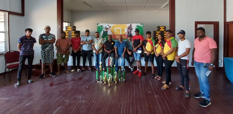 GT Beer Brand Manager Dwayne Bristol (centre) poses with several players and members of the coordinating team at the official launch of the East Coast Demerara edition of the GT Beer 5/5 tapeball cricket competition on Saturday