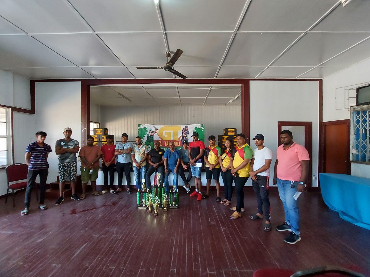 GT Beer Brand Manager Dwayne Bristol (centre) poses with several players and members of the coordinating team at the official launch of the East Coast Demerara edition of the GT Beer 5/5 tapeball cricket competition.