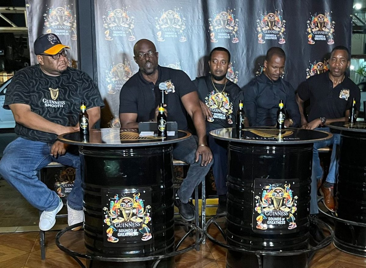 Guinness Brand Manager Lee Baptiste (2nd from left) addresses the gathering at the official activation of the Guinness brand at the Grill and Jerk Guinness Bar