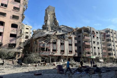 Damaged residential buildings are seen in the aftermath of Israeli strikes, near Al-Quds hospital in Gaza City, October 30, 2023. REUTERS/Mohammed Al-Masri