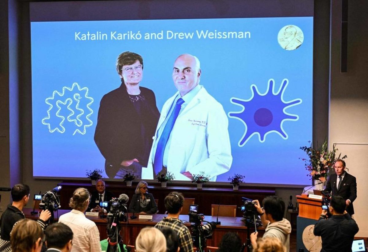 A screen at the Karolinska Institute shows this year’s laureates Katalin Kariko of Hungary (L) and Drew Weissman of the US during the announcement of the winners of the 2023 Nobel Prize in Physiology or Medicine at the Karolinska Institute in Stockholm on October 2, 2023. Katalin Kariko of Hungary and Drew Weissman of the US won the Nobel Medicine Prize on Monday for work on messenger RNA (mRNA) technology that paved the way for the Pfizer/BioNTech and Moderna Covid-19 vaccines. (Photo by Jonathan NACKSTRAND / AFP)