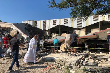 Members of security forces, people and a priest work at a site where a church roof collapsed during Sunday mass in Ciudad Madero, in Tamaulipas state, Mexico in this handout picture distributed to Reuters on October 1, 2023. Secretaria de Seguridad Publica Tamaulipas/Handout via REUTERS