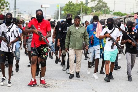 Former police officer Jimmy "Barbecue" Cherizier, leader of the 'G9' coalition, leads a march surrounded by his security against Haiti's Prime Minister Ariel Henry, in Port-au-Prince, Haiti September 19, 2023. REUTERS/Ralph Tedy Erol     TPX IMAGES OF THE DAY