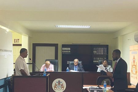 Inspector Krishna Seetaram (left) of the Mahdia Police Station testifying before the Commission of Inquiry
