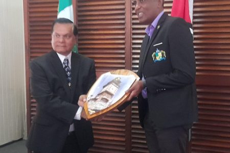 City Mayor Alfred Mentore (right) presenting a gift to visiting mayor from Arima, Balliram Maharaj
